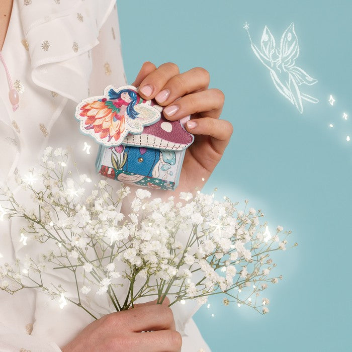 Vendula London Fairy Village Pods Case – model holding the pods case