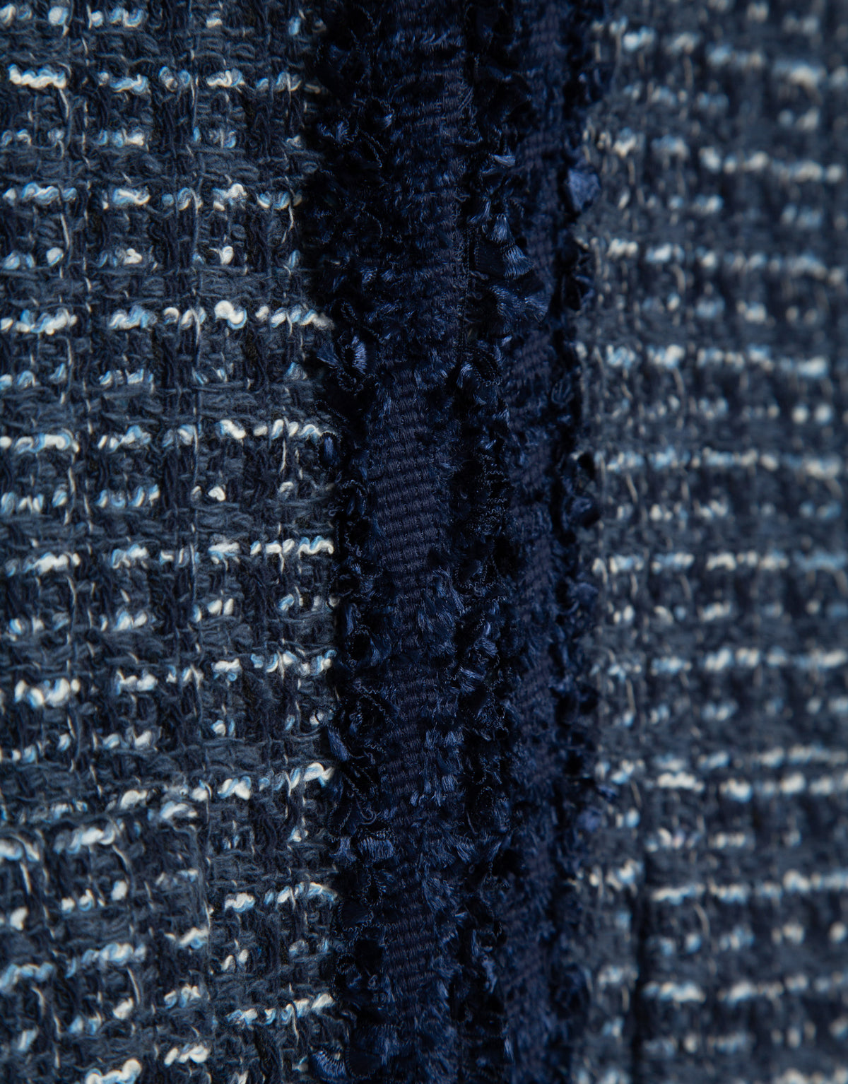 Short blue jacket with fringed trim on the front