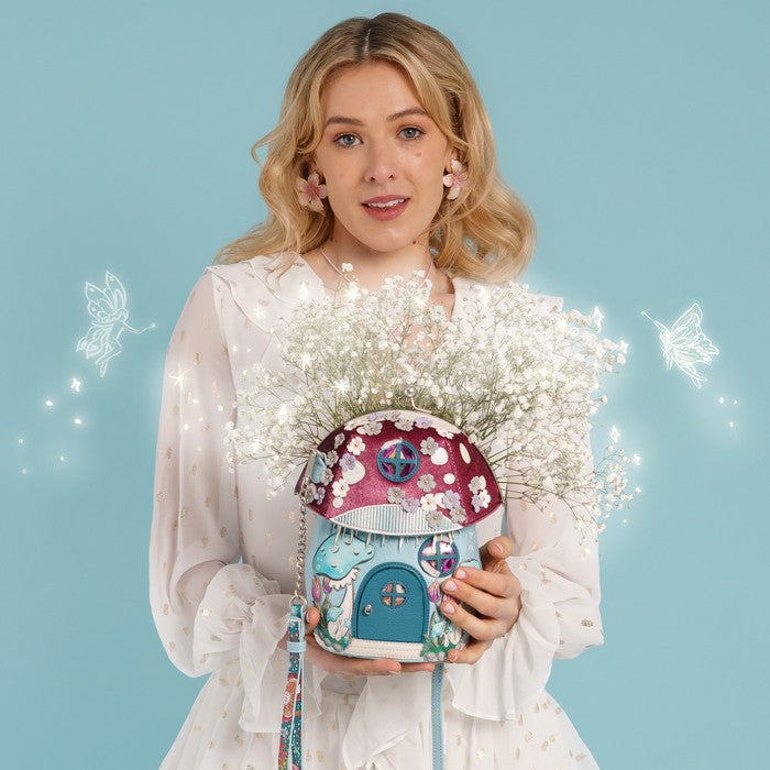 Vendula London Fairy Village Toadstool House Bag – model holding the bag