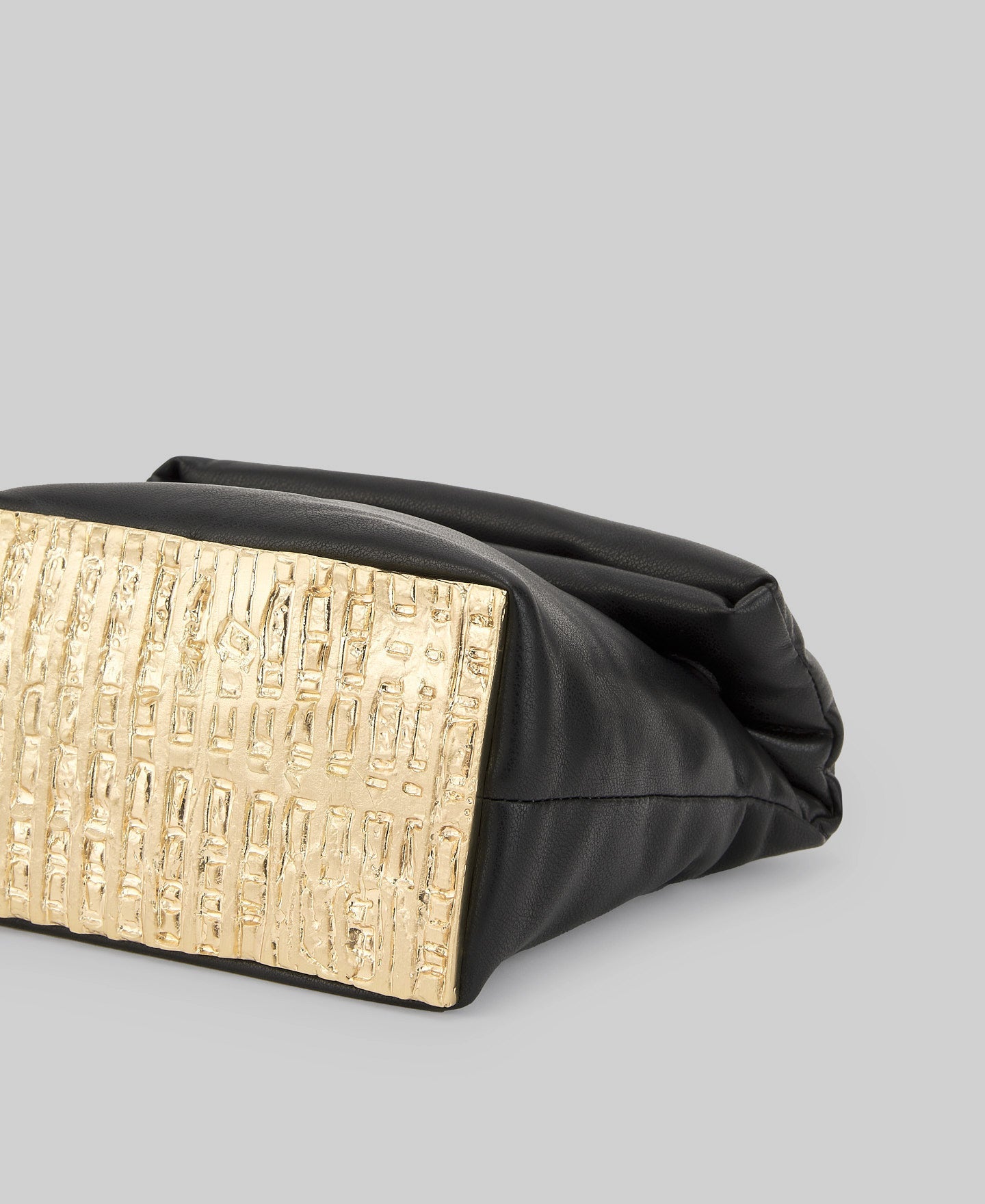 Quilted clutch with metallic base woman in black