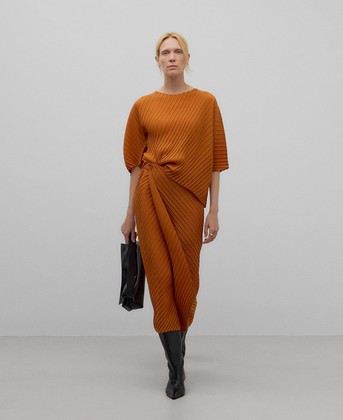 Asymmetrical crinkle top woman in orange