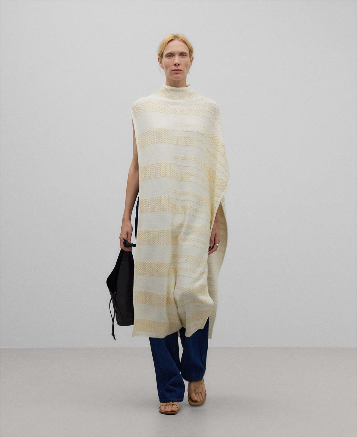 Asymmetrical jacquard cape woman in camel/ecru