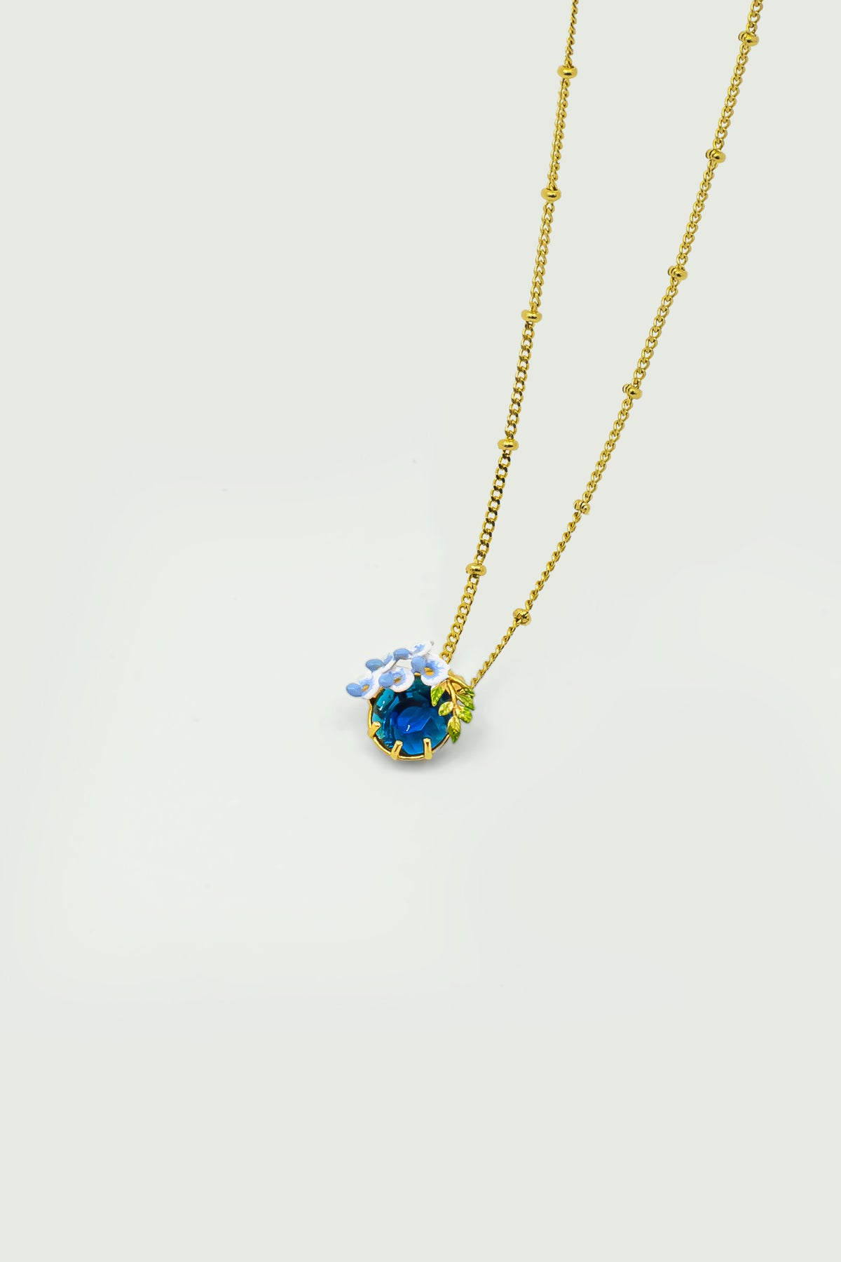 Blue Faceted Crystal And Wisteria Pendant Necklace | auof3021