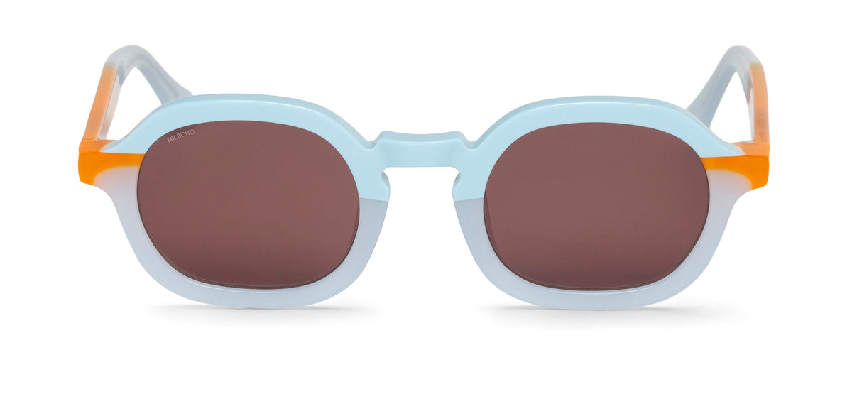 A pair of light blue with orange accents-framed oval sunglasses with dark lenses.