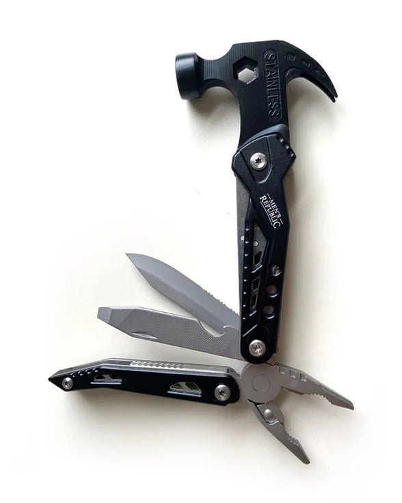 Multitool with hammer head and knife blade on a white background