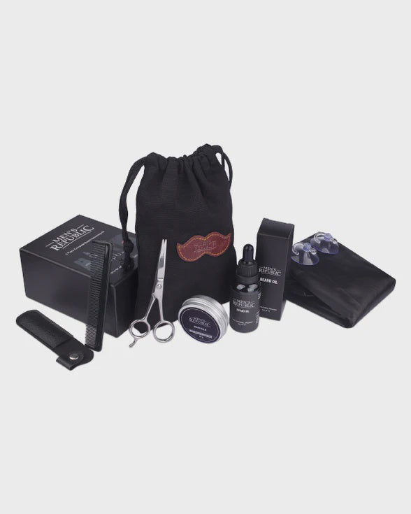 Collection of grooming products including a drawstring bag, scissors, bottles, and other items on a light gray background.
