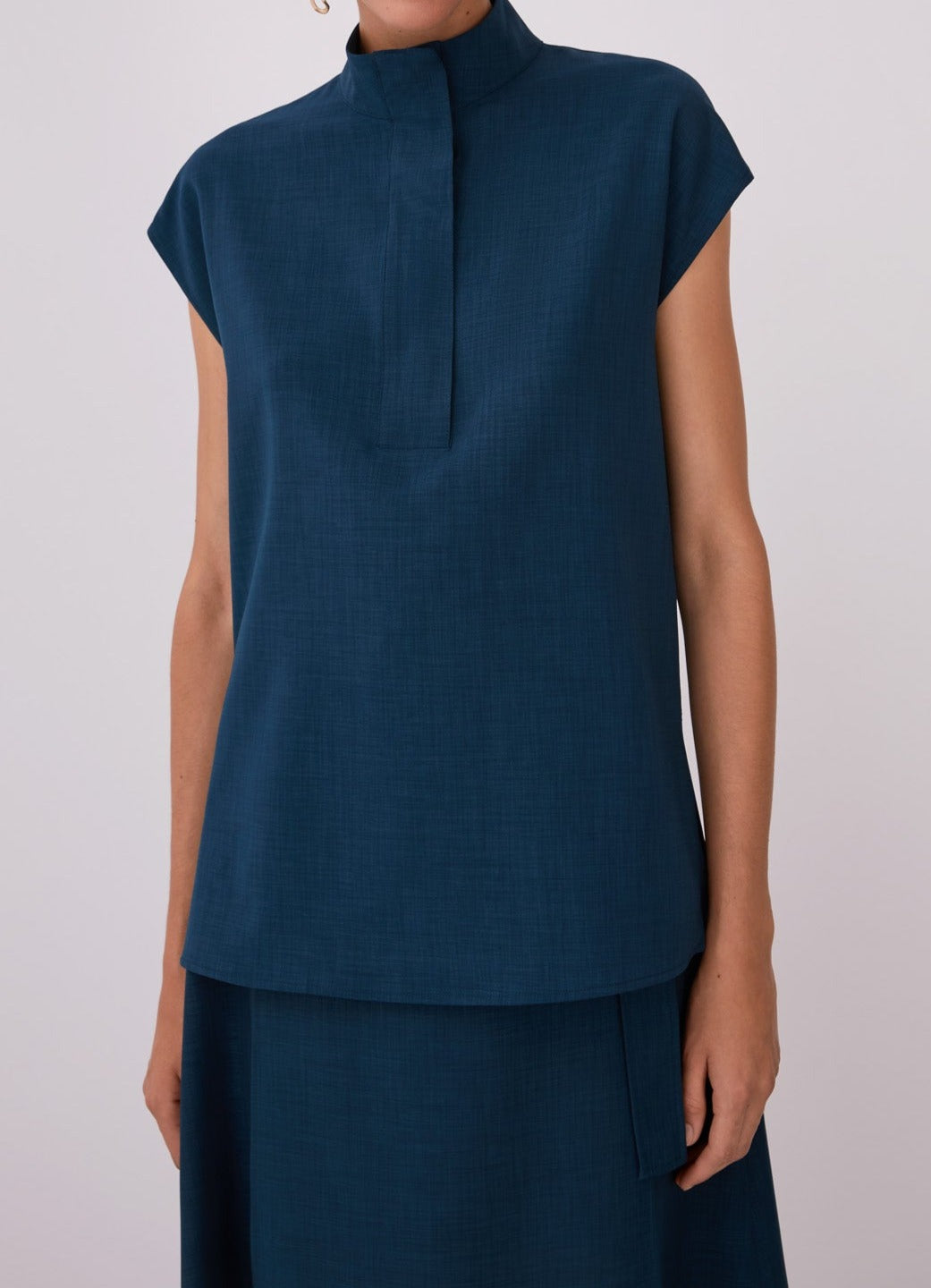 Women Short Sleeved Shirt | Blue High Collar Blouse With Flap by Spanish designer Adolfo Dominguez
