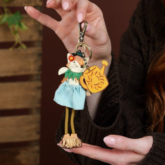 Vendula London The Farmhouse Pantry Scarecrow Key Charm held by model