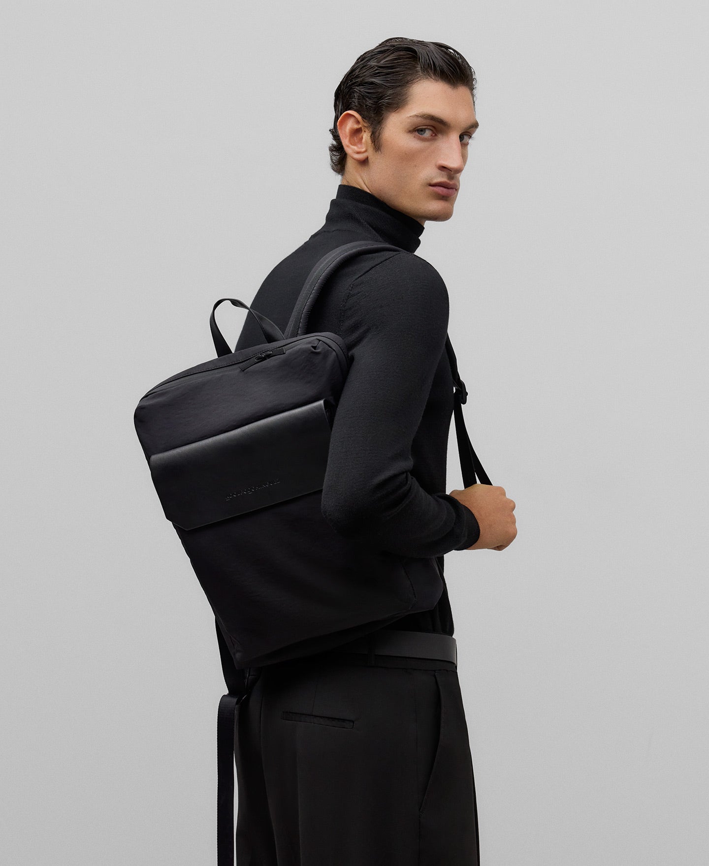 Flap compact backpack man in black
