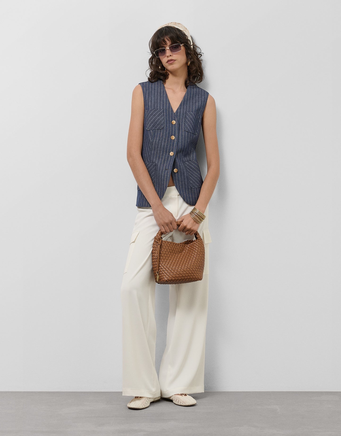 Blue denim and linen vest with gold outlines