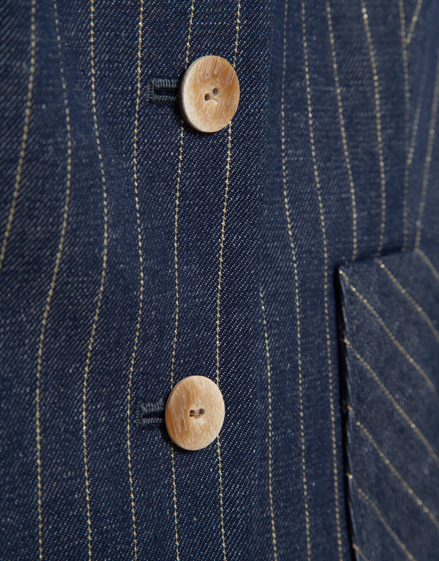 Blue denim and linen vest with gold outlines