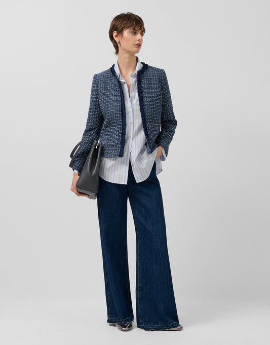 Short blue jacket with fringed trim on the front