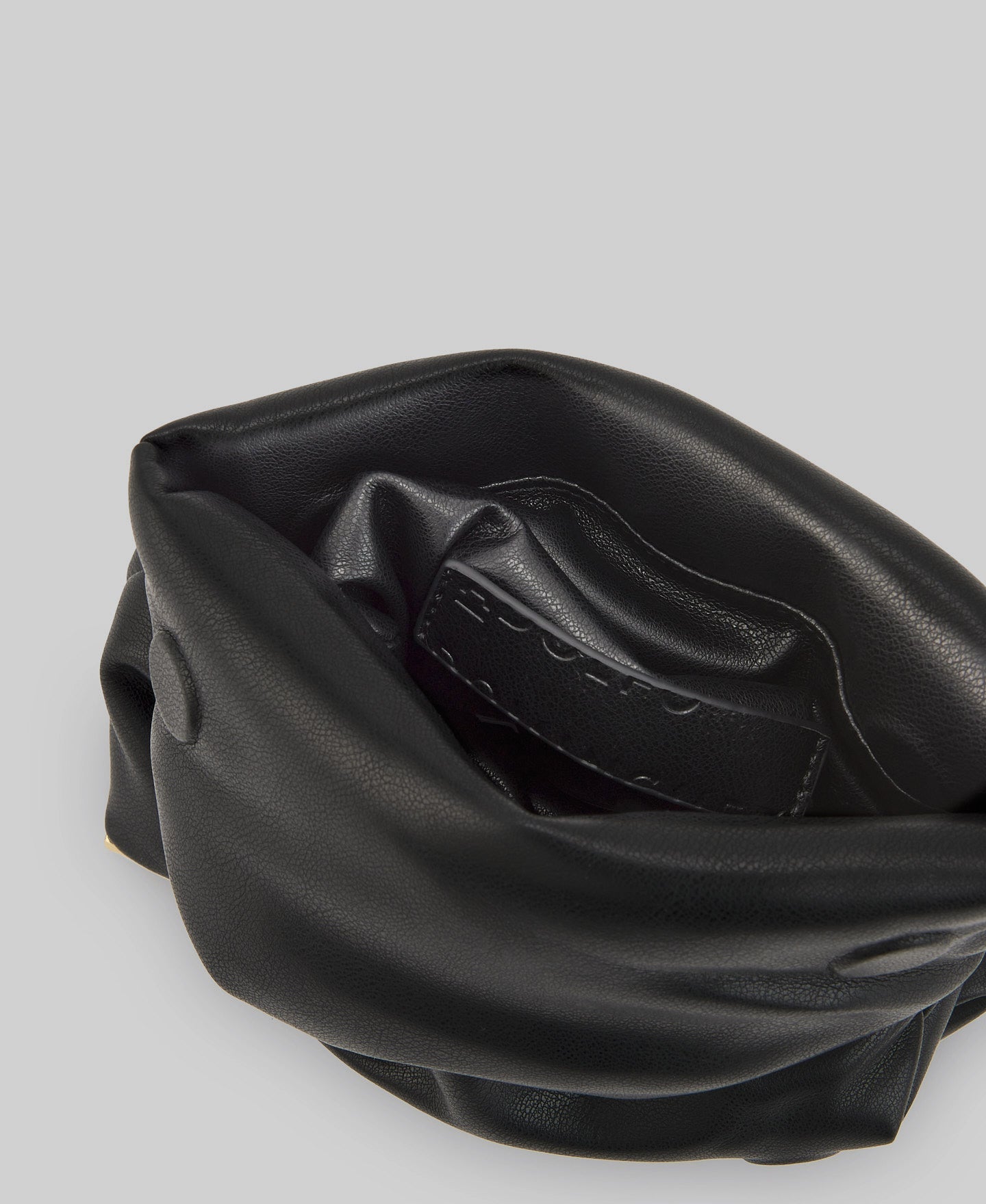 Quilted clutch with metallic base woman in black