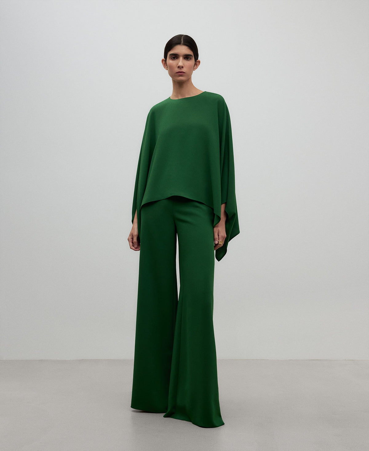 Wide green top woman in green
