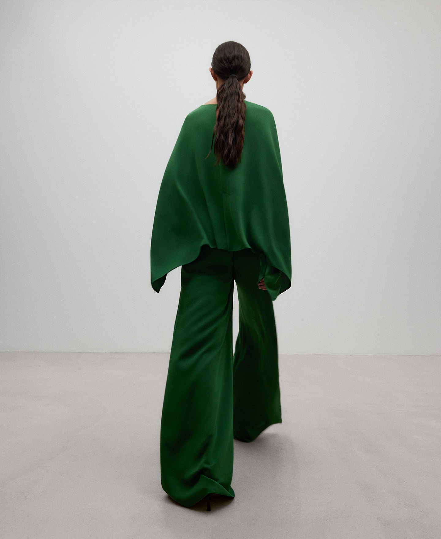 Wide green top woman in green