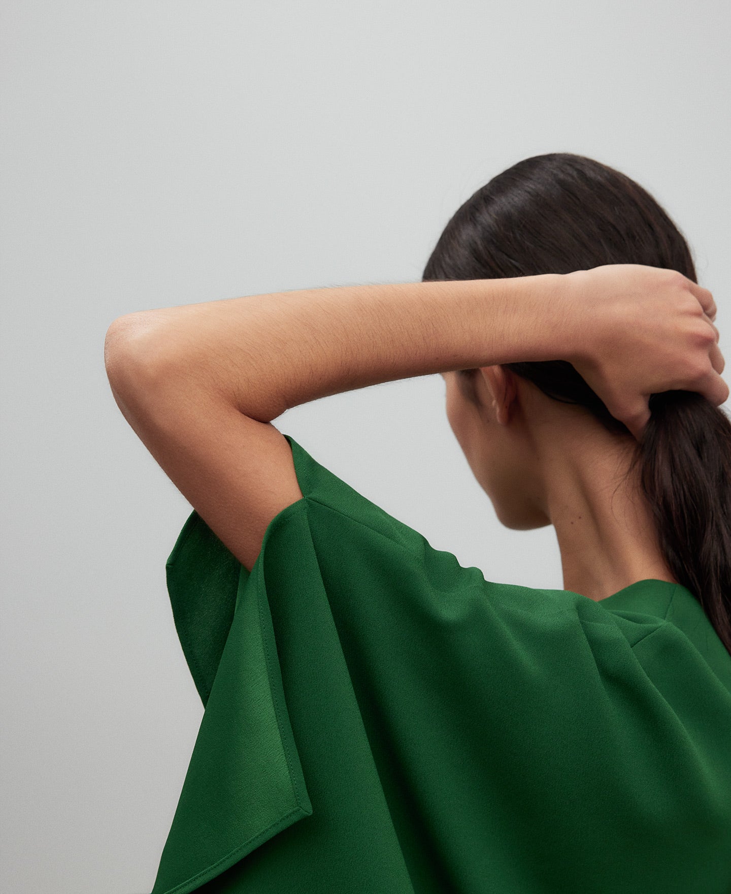 Wide green top woman in green
