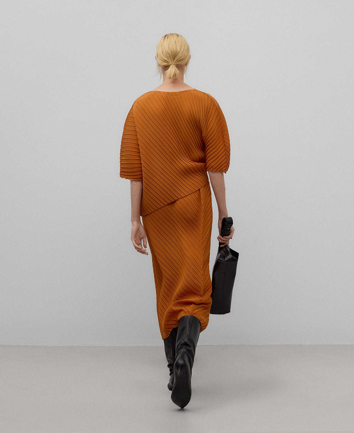 Asymmetrical crinkle top woman in orange