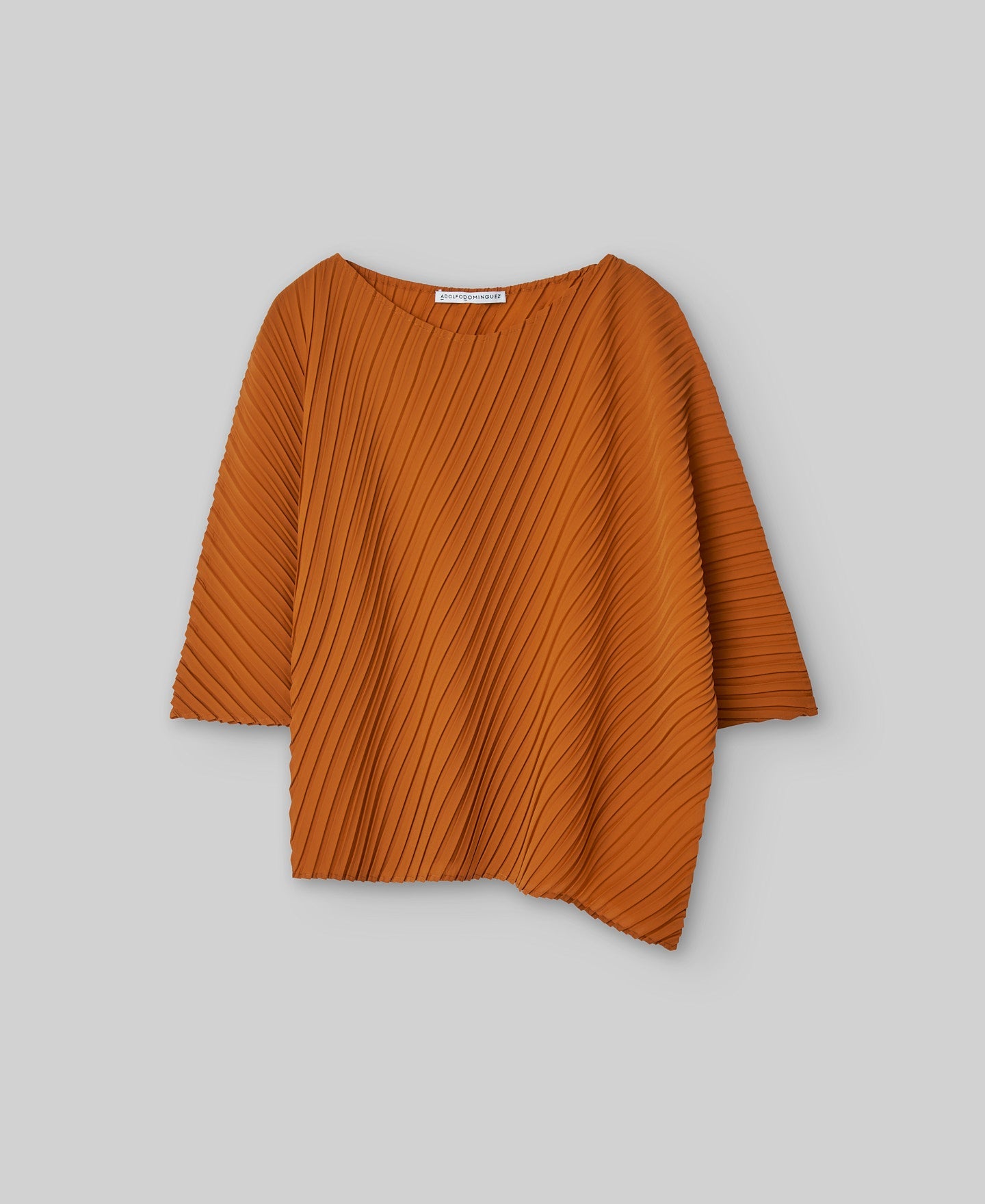 Asymmetrical crinkle top woman in orange