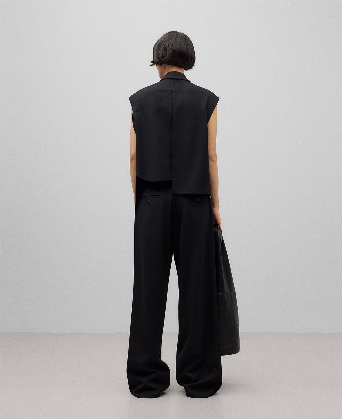 Black asymmetrical vest woman in black