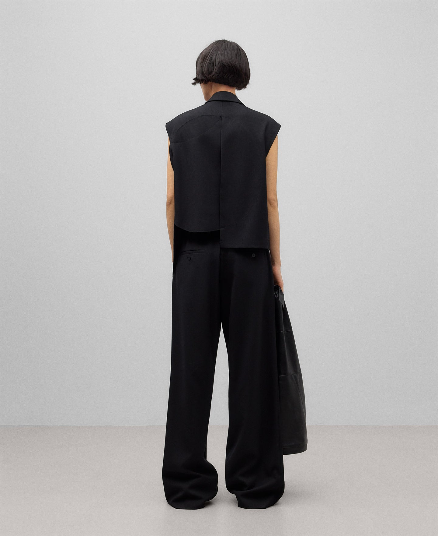 Black asymmetrical vest woman in black