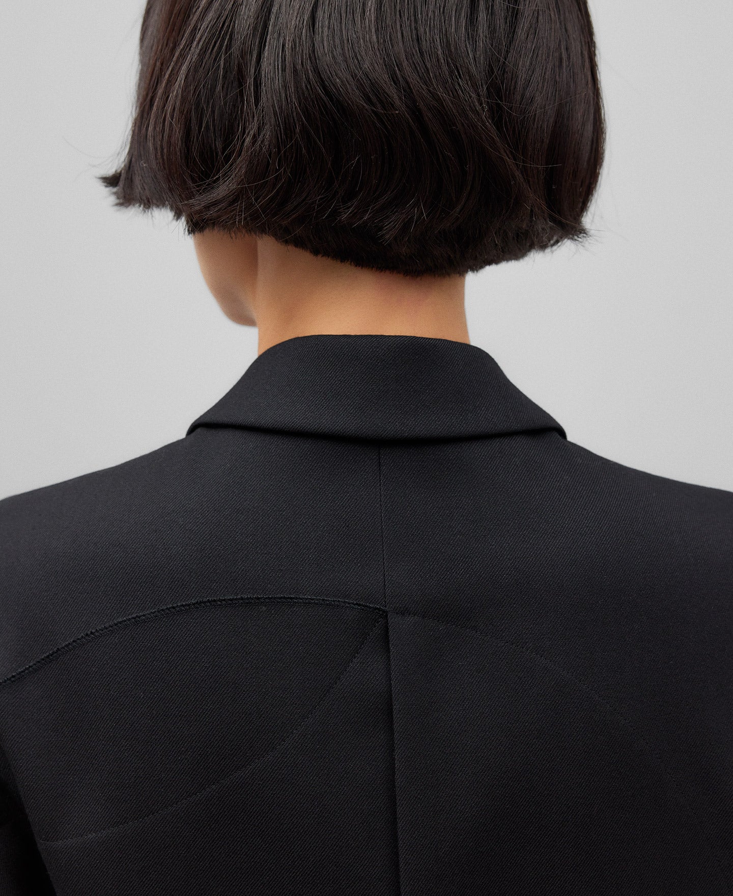 Black asymmetrical vest woman in black