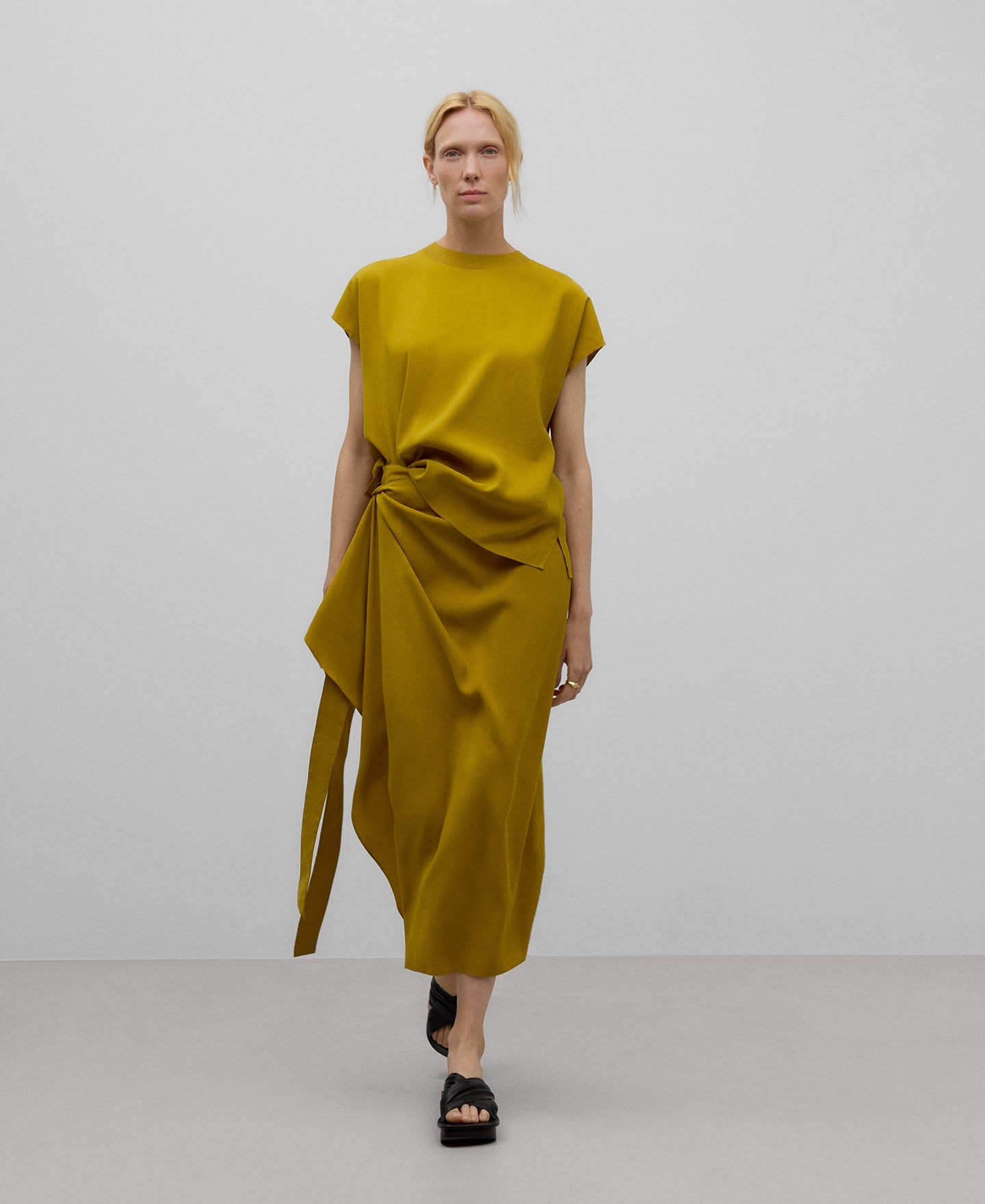 Draped skirt with knot woman in yellow turmeric