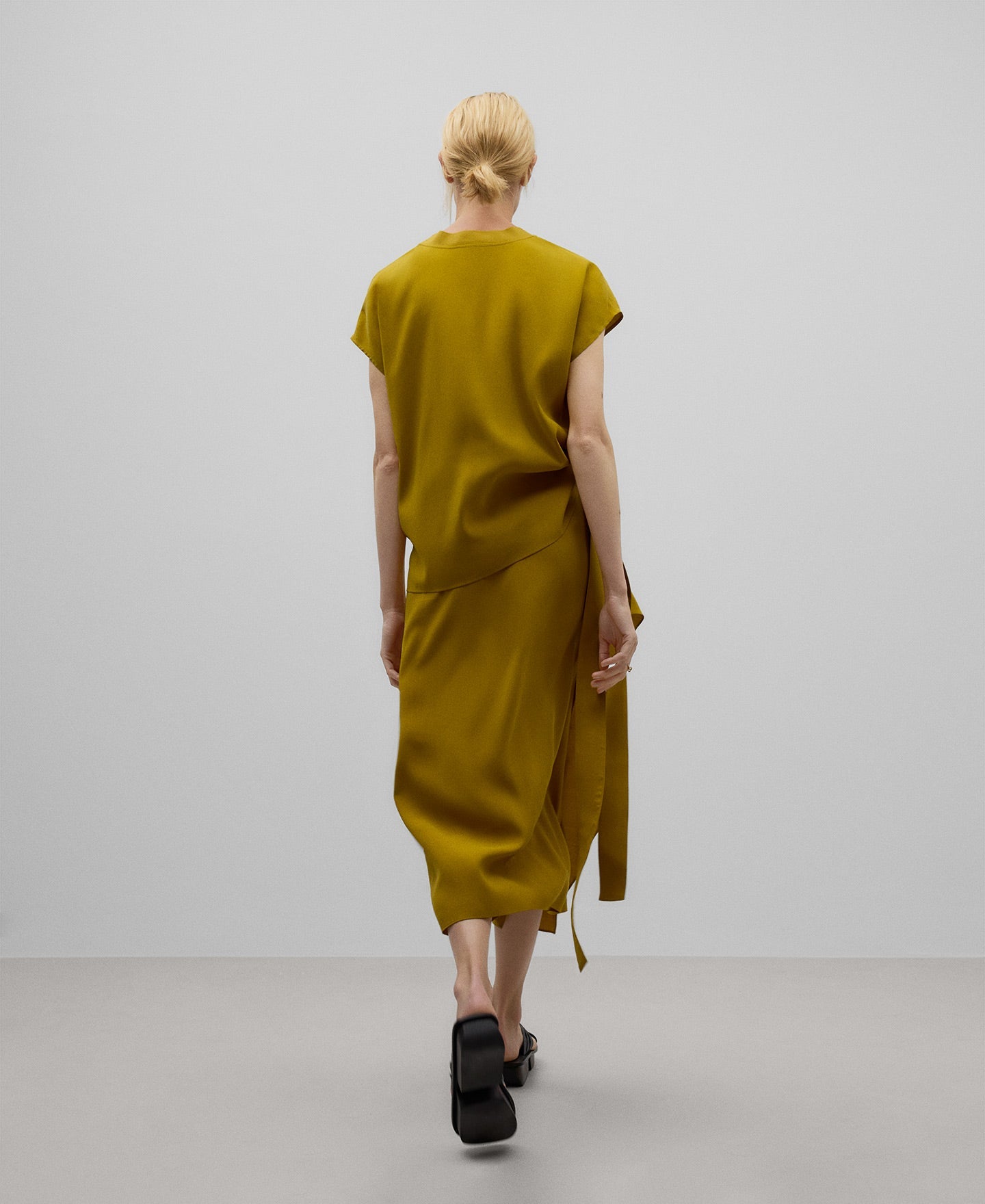 Draped skirt with knot woman in yellow turmeric