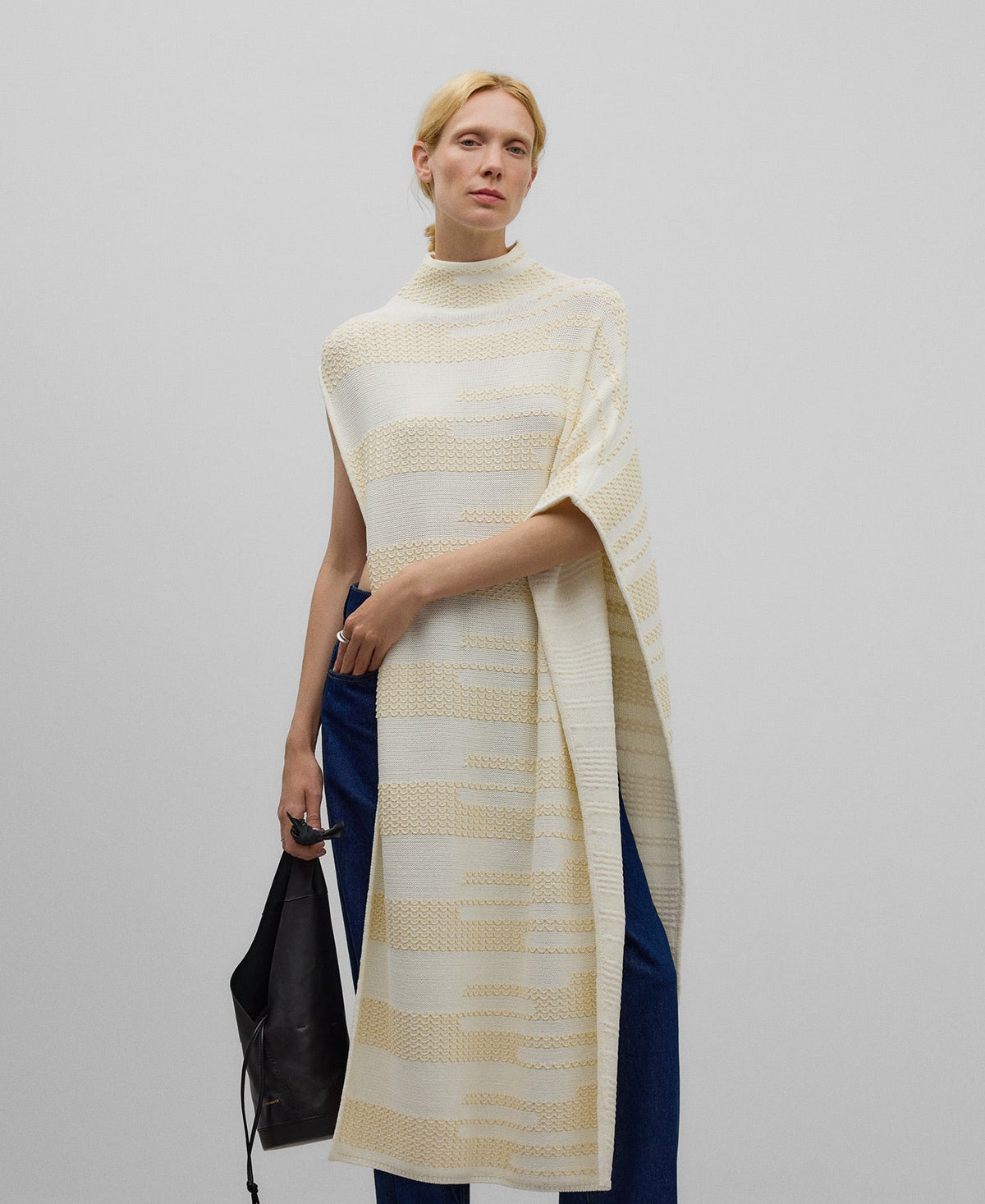 Asymmetrical jacquard cape woman in camel/ecru