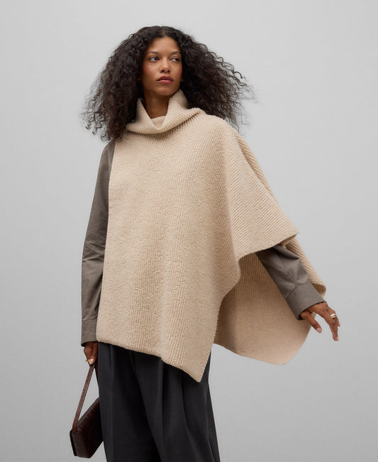 Asymmetrical terry cloth cape in light cream