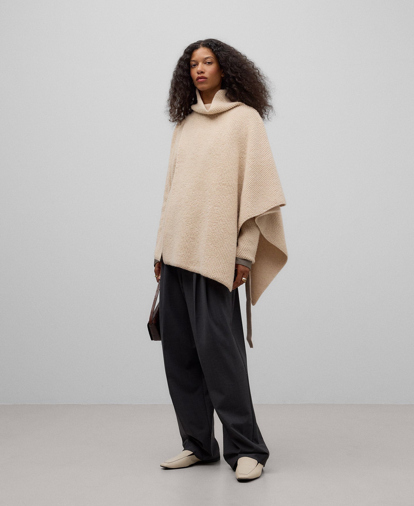 Asymmetrical terry cloth cape in light cream