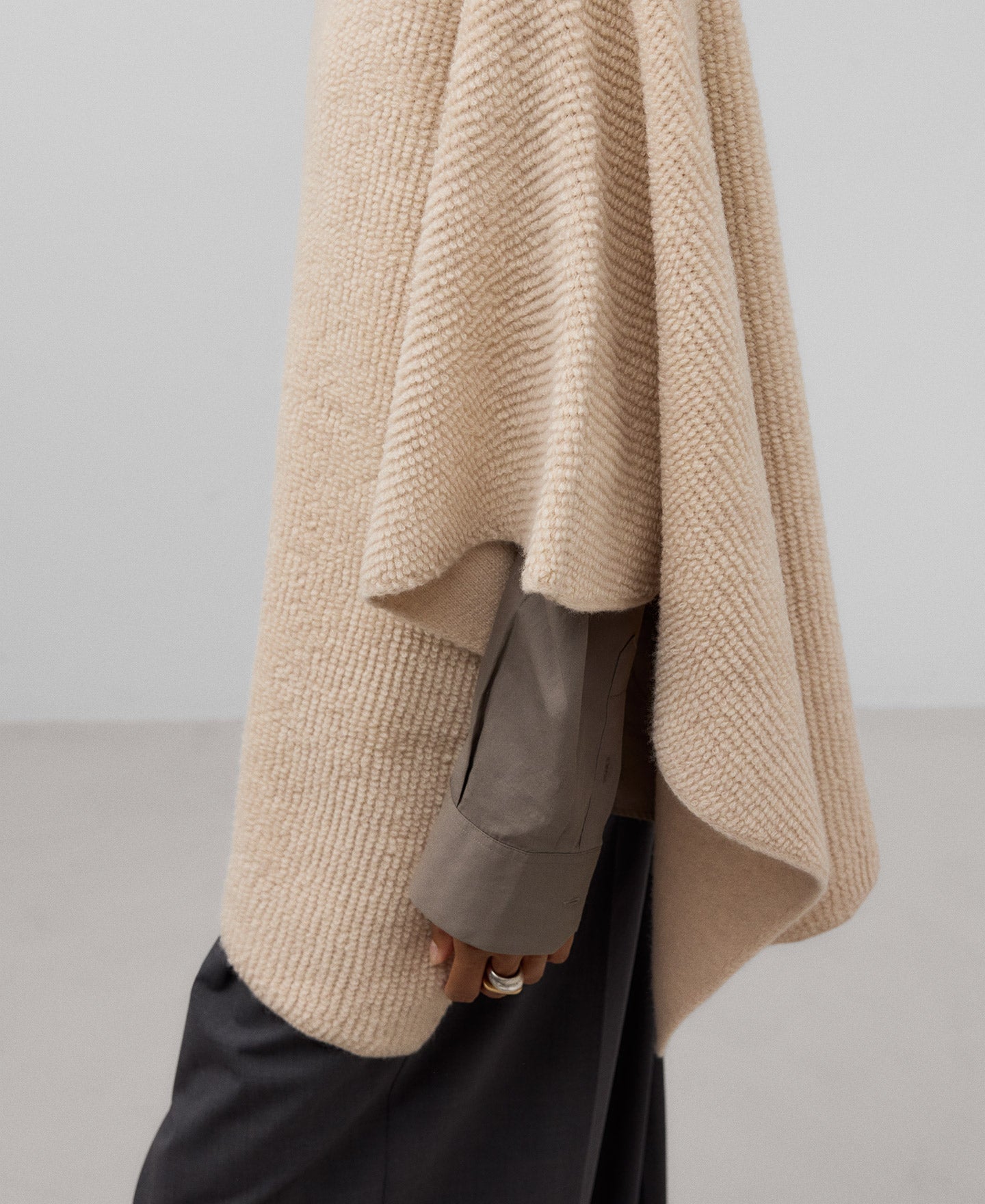 Asymmetrical terry cloth cape in light cream