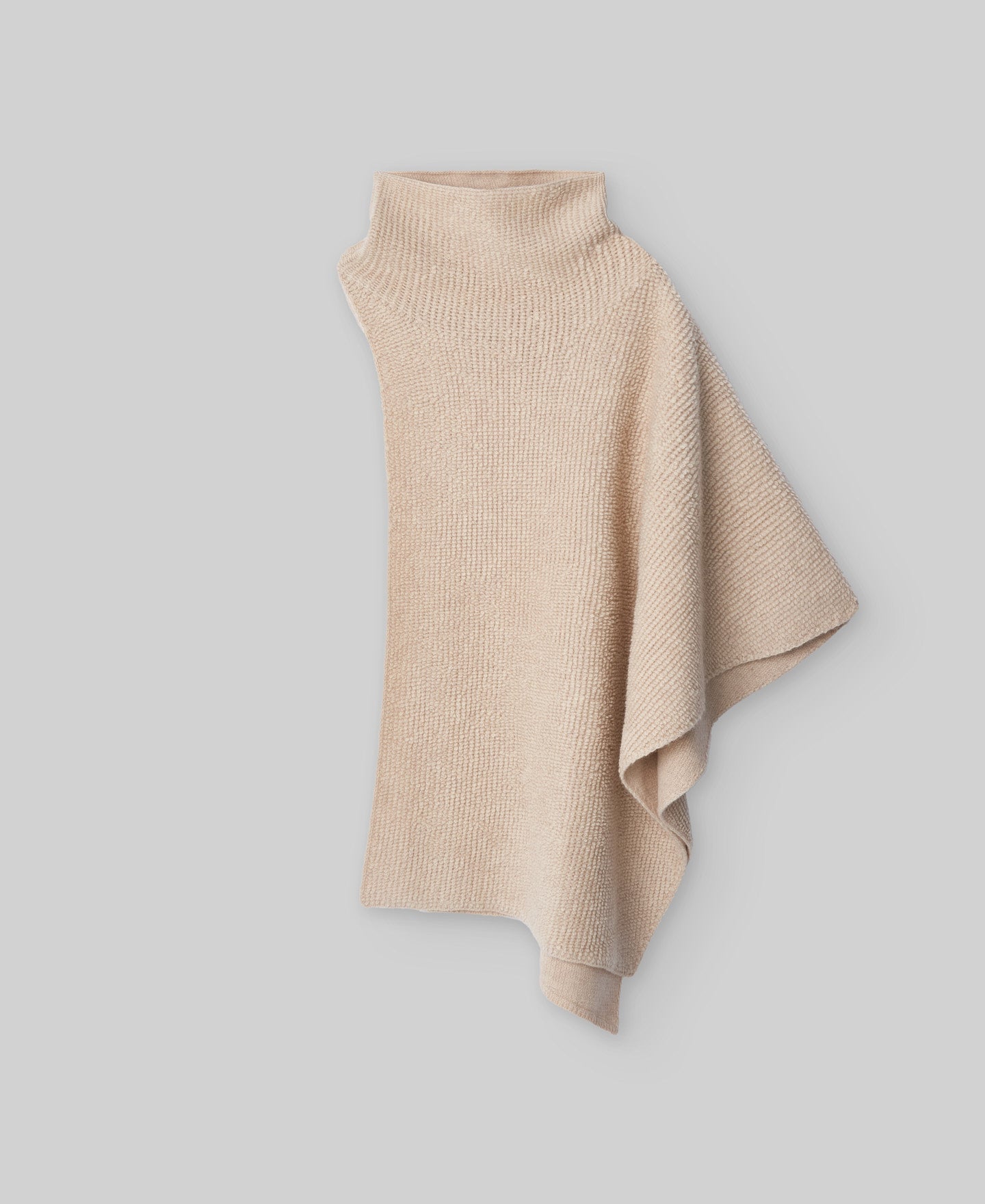 Asymmetrical terry cloth cape in light cream