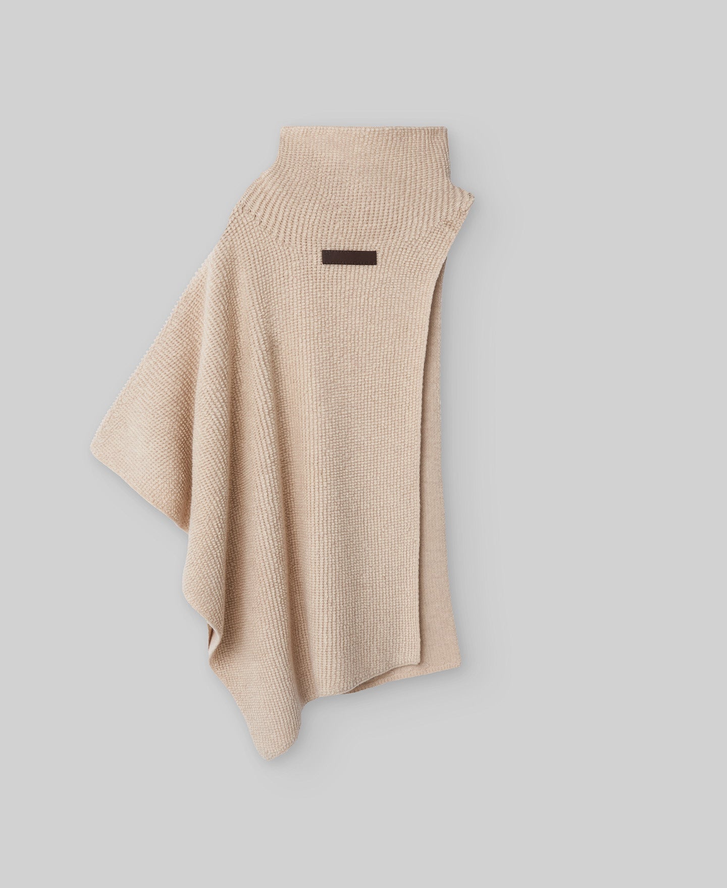 Asymmetrical terry cloth cape in light cream