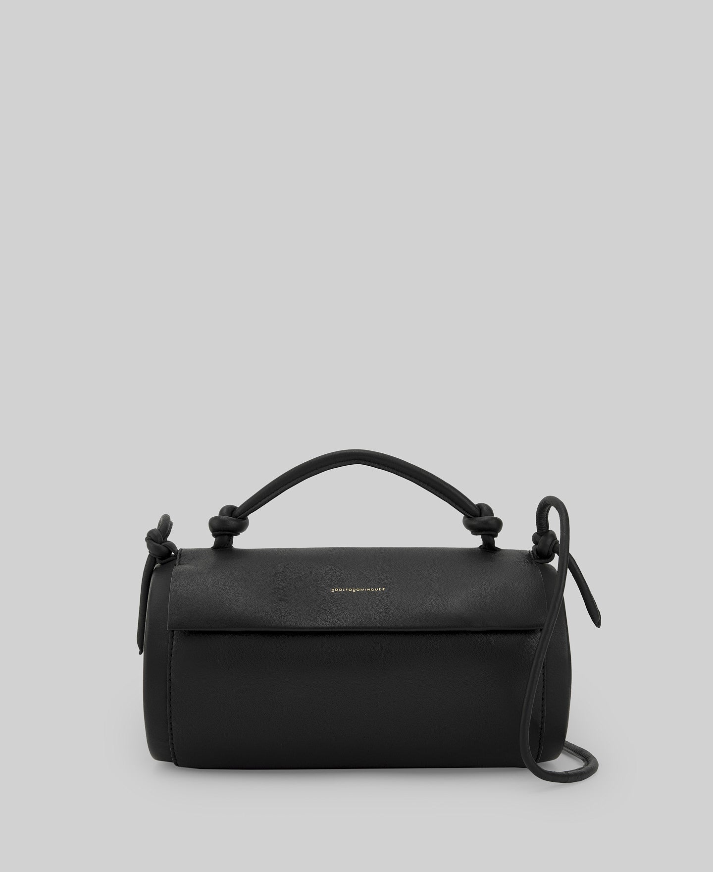 Black cylindrical leather bag woman in black