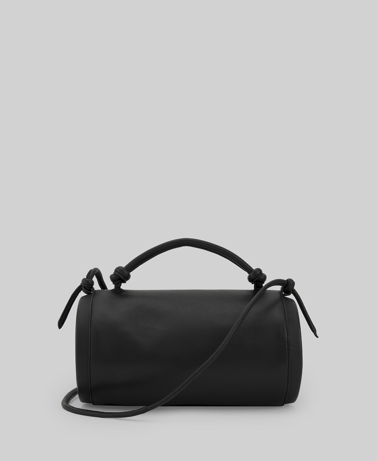 Black cylindrical leather bag woman in black