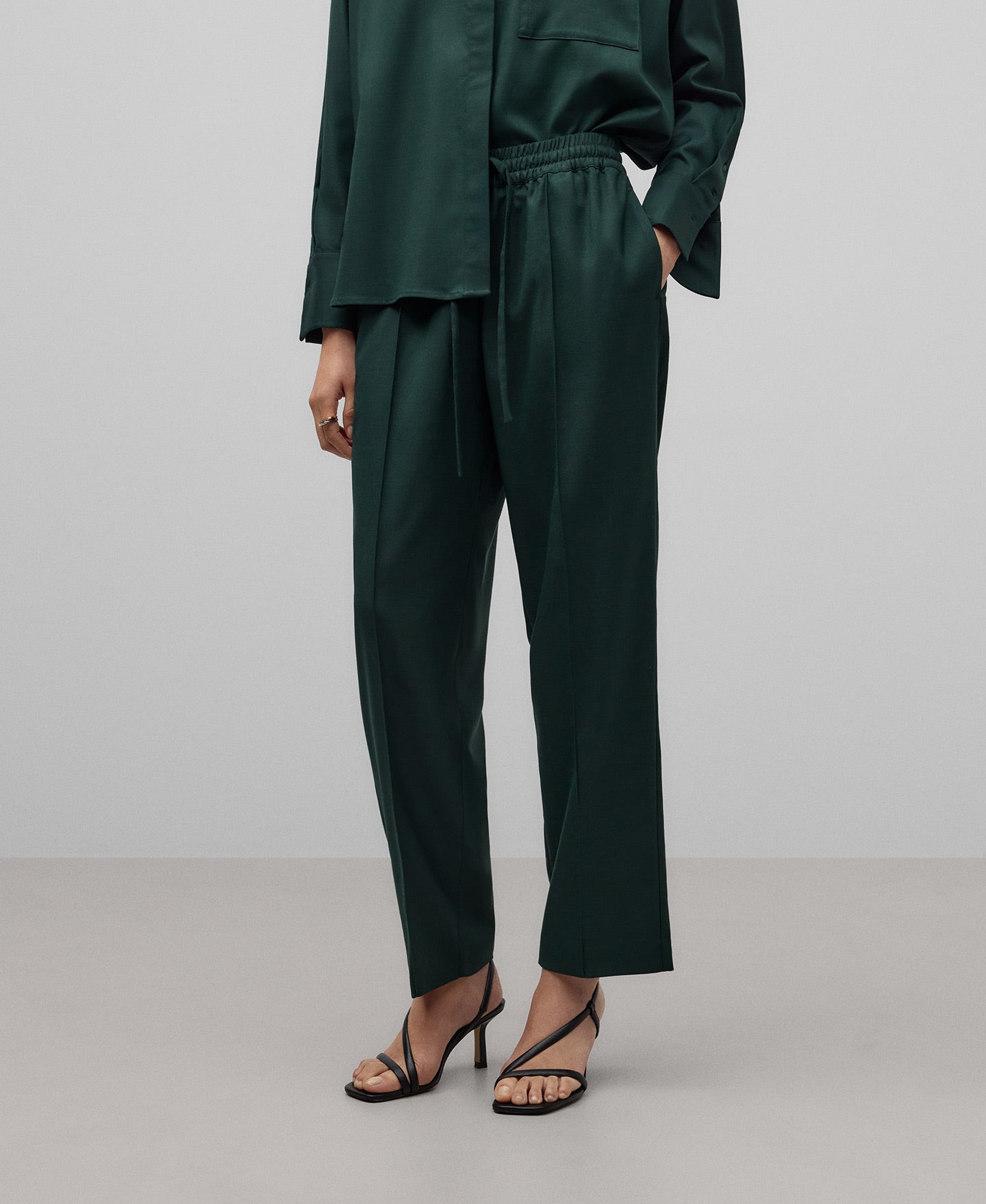 Green jogger trousers woman in dark green