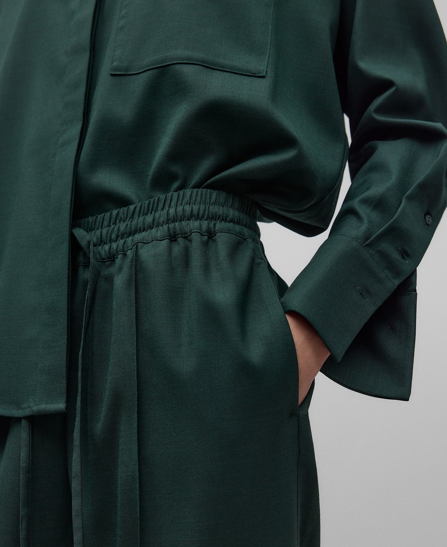 Green jogger trousers woman in dark green