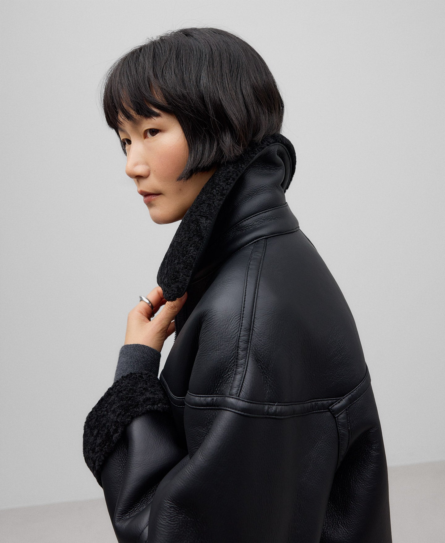 Leather-Non-Leather Long Coat in Black