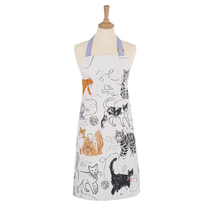 Light grey apron with illustrations of cats printed all over and a blue neck tie