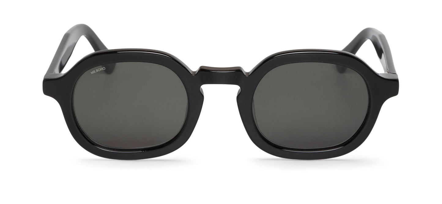 A pair of black framed oval sunglasses with dark lenses.
