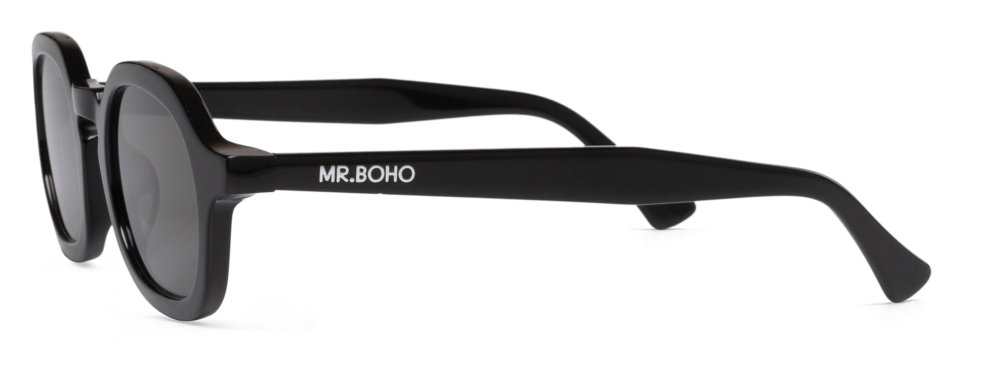 A pair of black-framed oval sunglasses with dark lenses side view with mr boho logo
