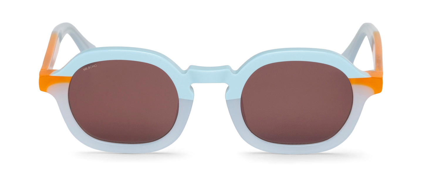 A pair of light blue with orange accents-framed oval sunglasses with dark lenses.