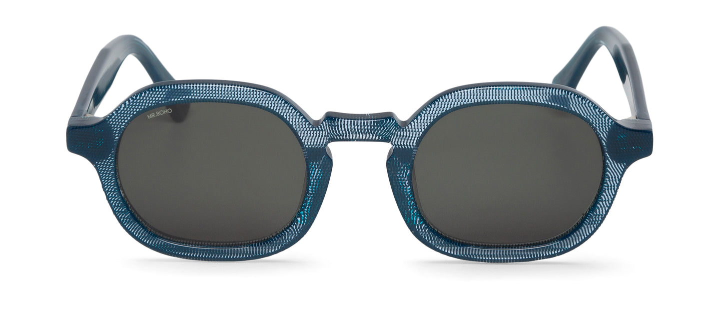 A pair of blue-framed oval sunglasses with dark lenses.