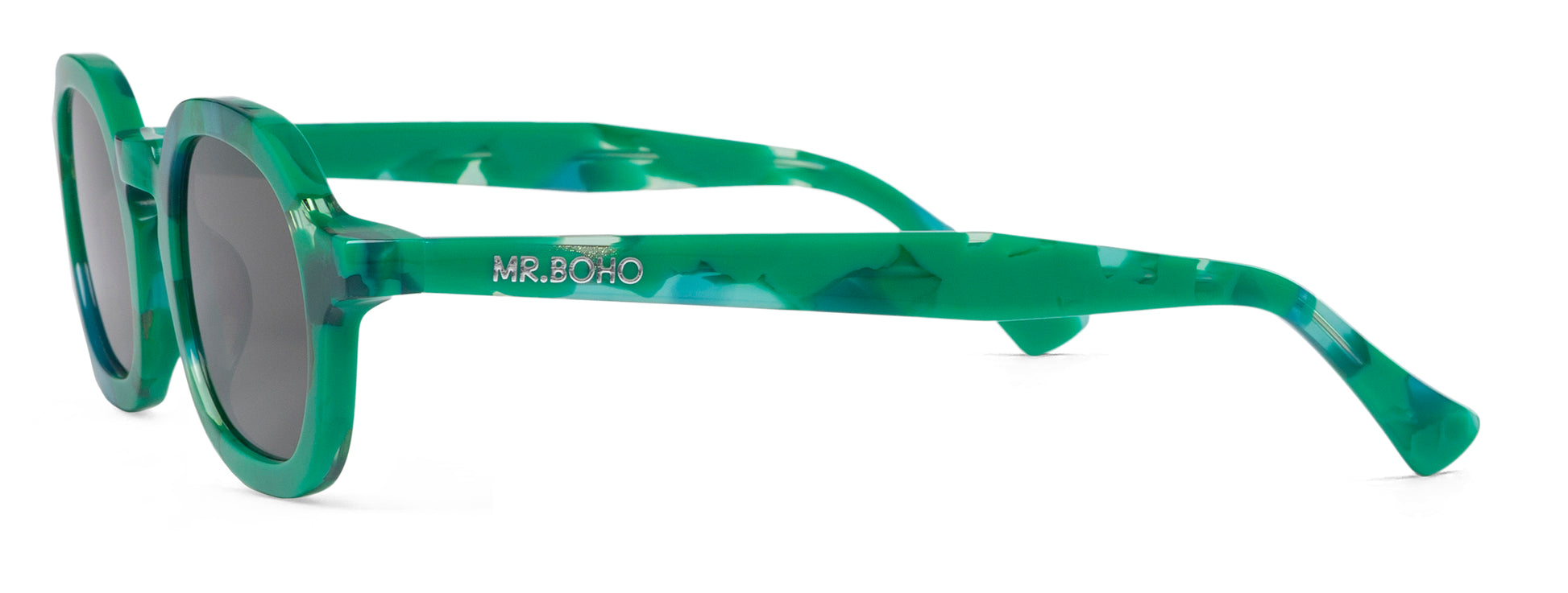 A pair of green mosaic pattern-framed oval sunglasses with dark lenses. - side view mr boho logo on arm