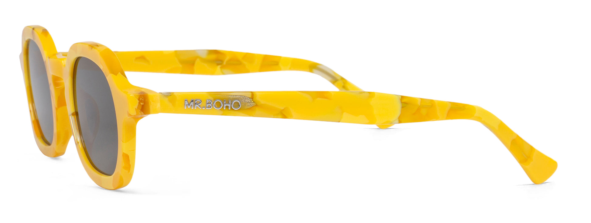 A pair of yellow framed oval sunglasses with dark lenses - side view mr boho logo on arm