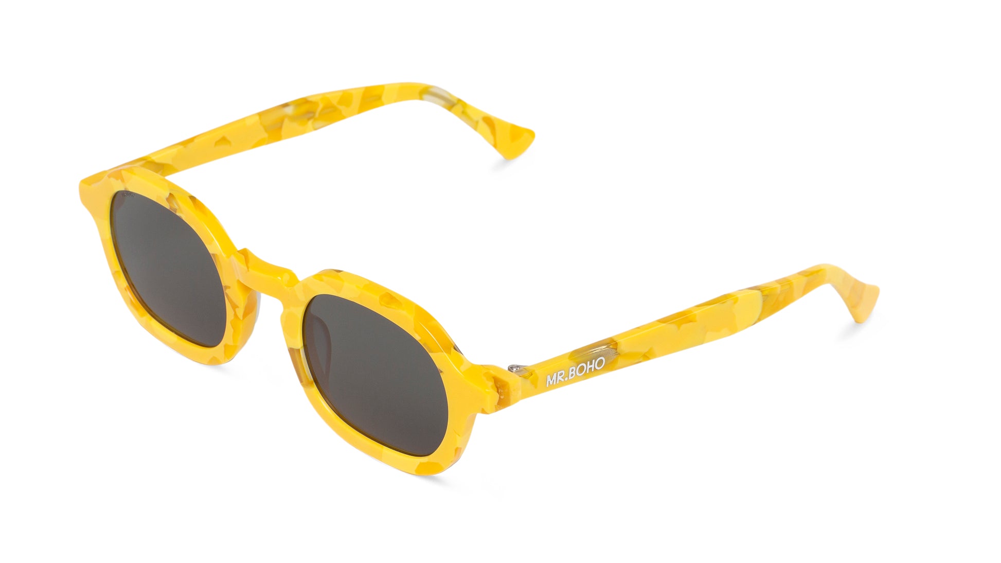 A pair of yellow-framed oval sunglasses with dark lenses. - arial view