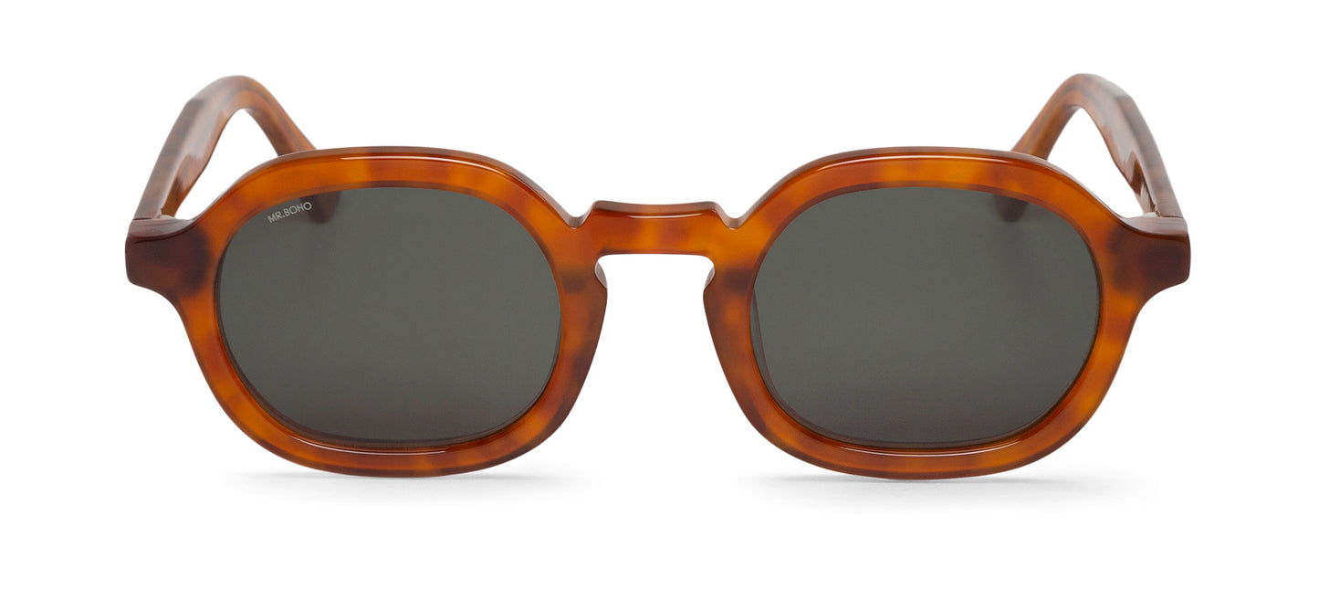A pair of brown-framed oval sunglasses with dark lenses.