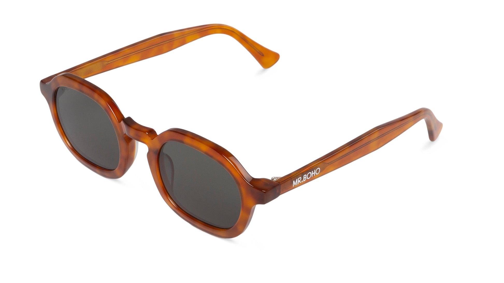 A pair of brown-framed oval sunglasses with dark lenses arial view