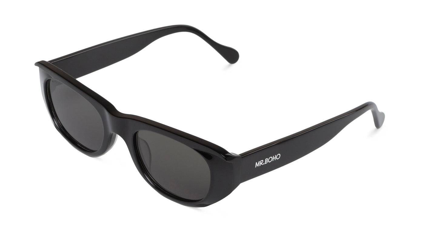 Rectangle with cat eye framed sunglasses in black with dark lenses - arial view