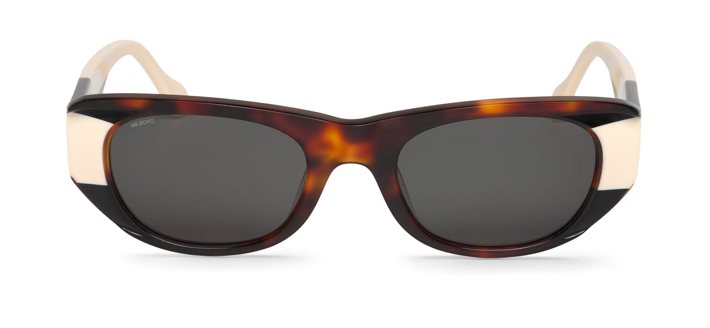 Rectangle with cat eye framed sunglasses in tortoiseshell with white accents and dark lenses